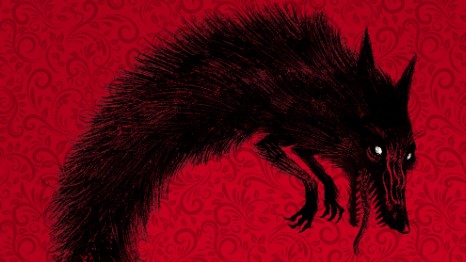 silhouette éffrayante de loup noir sur fond rouge